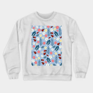 Spring meadow in bloom with ladybirds on sky blue background Crewneck Sweatshirt